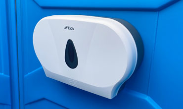 Double toilet roll dispenser fitted to a portaloo