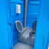 Blue portaloo with a urinal fitted
