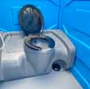 A flushing portaloo with a foot pump