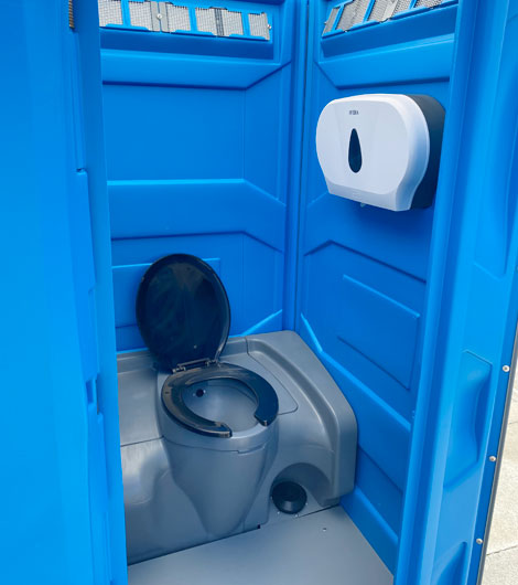 The holding tank and foot flusher of a flushing portaloo
